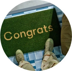 patio rug with text that says, "congrats" implying the purchase of your first house